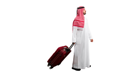 Arab man with suitcase white background in traditional costume. Ready for cutting and editingの写真素材