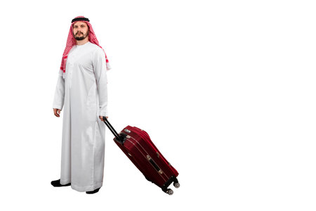 Male Arab with suitcase isolated white background in traditional costume. Ready for cutting and editingの写真素材