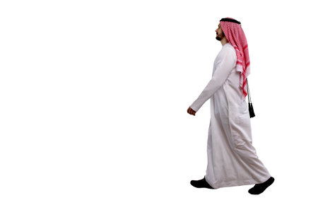 Arabic man walking sideways isolated white background in traditional costume. Ready for cutting and editingの写真素材