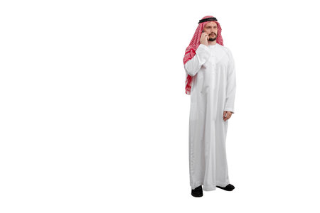 Arab man talking on phone isolated white background in traditional costume. Ready for cutting and editingの写真素材
