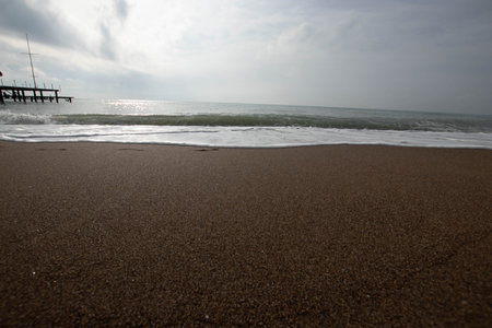 View of the sea and the beach. tides, waves on the sea. beautiful sandの写真素材
