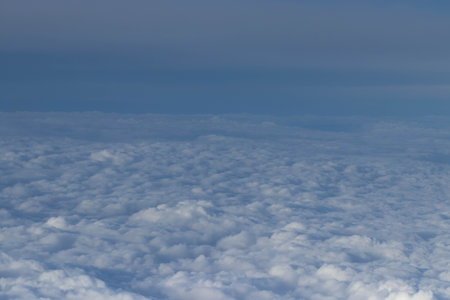 Clouds from an airplane window, beautiful view of blue clear sky and clouds.の写真素材