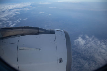 Airplane engine view from the window. Flying with a beautiful view of the sky and clouds