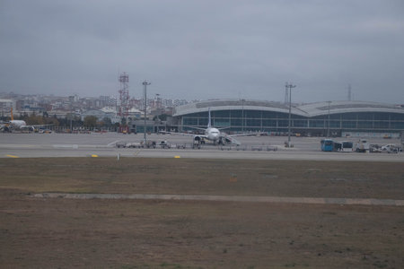 Landing and inspecting the airplane at the airport on the runwayの写真素材
