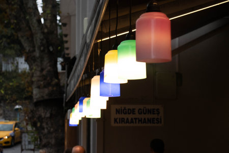 Colored street lights shine at the entrance to the cafeの写真素材