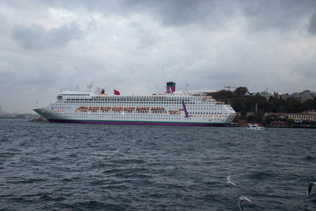 A large luxury cruise ship docked at the port of Istanbulの写真素材