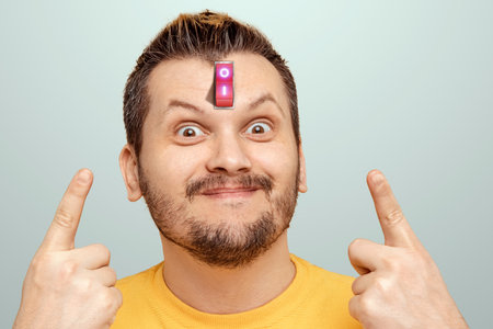 A businessman has a red switch in his head. The concept of turning on the power of the brain, turning off negative thoughts, turning on the thought process, generating ideasの写真素材