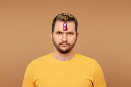 A businessman has a red switch in his head. The concept of turning on the power of the brain, turning off negative thoughts, turning on the thought process, generating ideasの写真素材