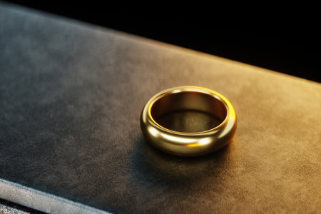 Metal heavy anvil and golden ring isolated on a dark background. 3D illustration, 3D render, photorealismの写真素材