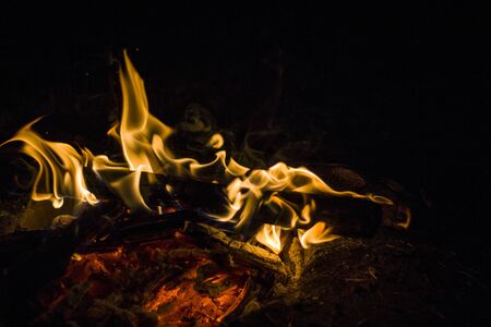 Isolated shot of small camp fire in the night.の写真素材