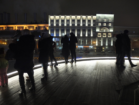 Night view of tourists on the bridge in Park Zaryadyeのeditorial素材