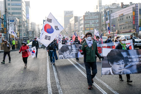 Seoul March 24th. People manifest against actual government in South Korea. Against president Moon Jae-in and his politics for unification of Korean peninsula. Asking USA help, asking Trump help.のeditorial素材