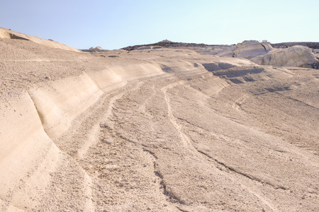 The last tourist of the year enjoy the end of summer in one of the best cliff of the greek island Milos.の写真素材