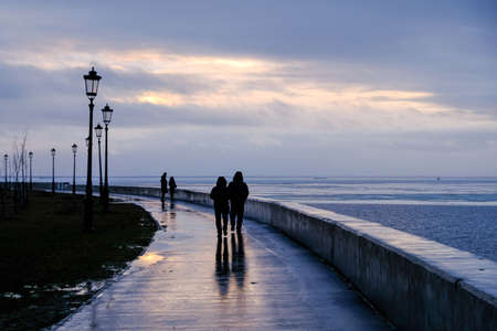 A couple is walking at the suset close to the Baltic sea.のeditorial素材