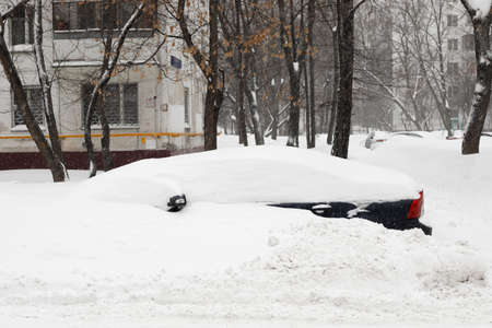 Moscow, Russia. 13th February 2021. A blizzard covered the city. A Volvo car is completely covered under the snow.のeditorial素材