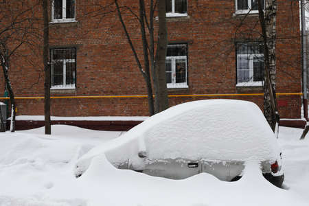 Moscow, Russia. 13th February 2021. A blizzard covered the city. A car completely covered by the snow.のeditorial素材