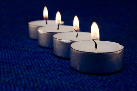 Few candles on blue tableの写真素材