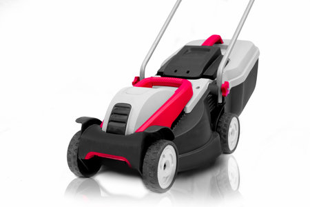 New lawn mower isolated on a white backgroundの写真素材