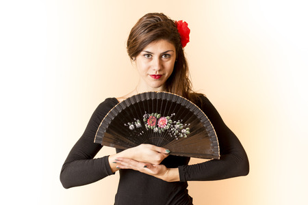 Girl posing with a  fanの写真素材