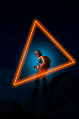 Female in nature outlined with a neon triangleの写真素材