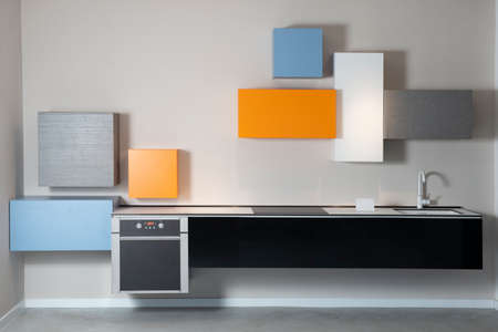 Minimalistic, lively and modern kitchen in a expensive flatの写真素材