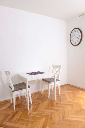 Dining room with a table for two in a renovated apartmentの写真素材