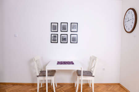 Dining room with a table for two in a renovated apartmentの写真素材