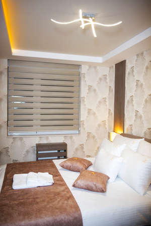 Interior of a bedroom with fresh beddingsの写真素材