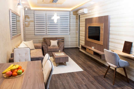 Cozy modern living room with smart appliancesの写真素材