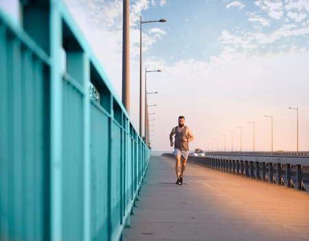 Young man training alone outside in a open safe areaの写真素材