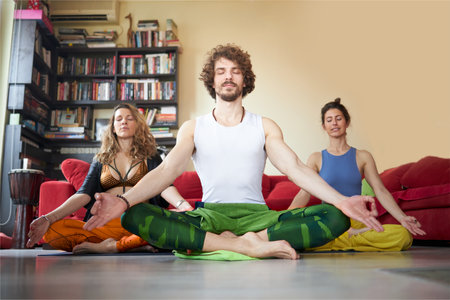 Three friends preparing for their yoga classの写真素材