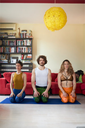 Three friends preparing for their yoga classの写真素材