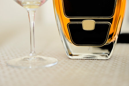 Detail of a whiskey bottle and a glassの写真素材