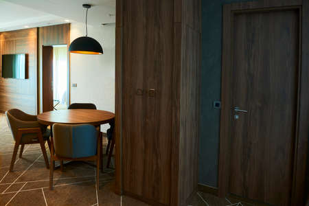 Modern dining room interior with wooden table and chairsの写真素材