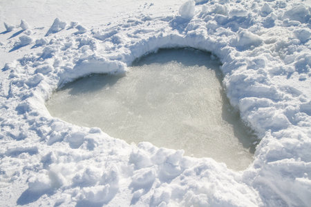 A heart shaped clearing on a frozen lake