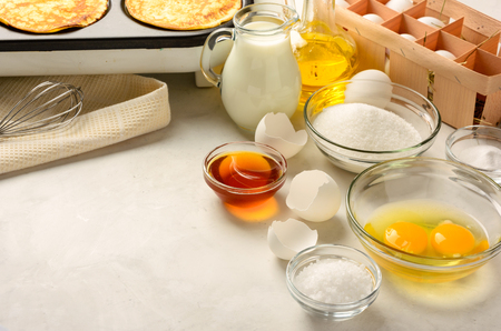 Ingredients for making pancakes on a white background. Copy space.の写真素材
