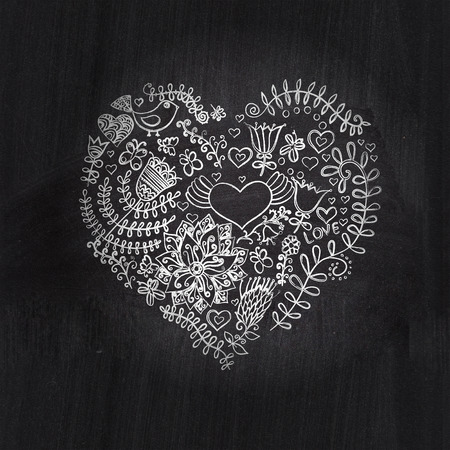 Heart shape chalk drawing on chalkboard blackboard.Floral heart. Heart made of flowers.Doodle Heartの写真素材