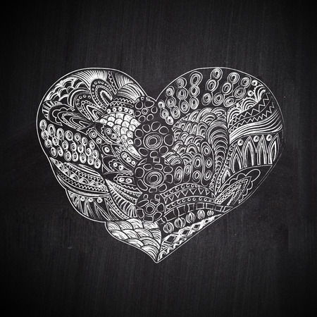 Heart shape chalk drawing on chalkboard blackboard. Doodle Heartの写真素材