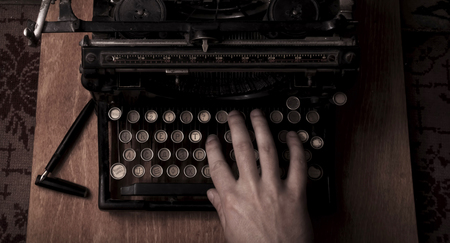 Typing on the vintage typewriterの写真素材