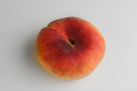 ripe peach fruits isolated on white backgroundの写真素材