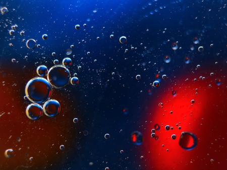 abstract colorful backdrop with oil drops on water surface. possible themes for the application - cosmetic advertising, space, fantasy.の写真素材