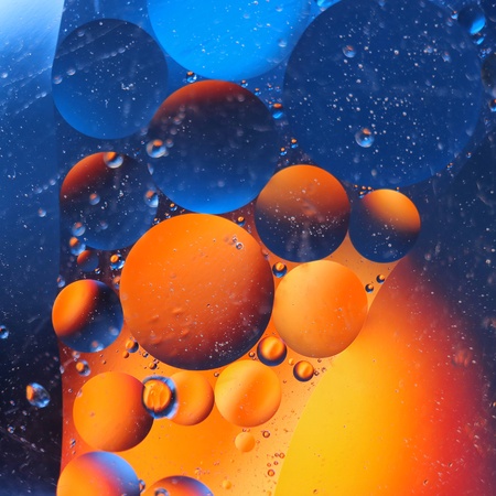 abstract colorful backdrop with oil drops on water surface. possible themes for the application - cosmetic advertising, space, fantasy.の写真素材