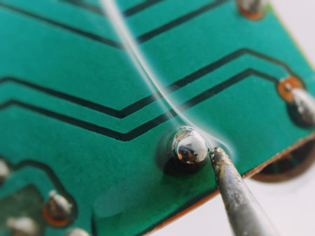 soldering contact on a printed circuit board, isolated image on a white background, macro shooting,...