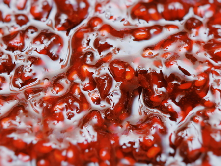 Raspberry Jam macro. Beautiful texture: bright Raspberry jam. Excellent background Raspberry Jam. Juicy taste.の写真素材