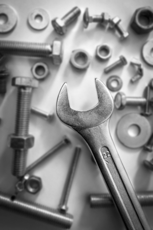 fasteners - car keys, nuts and bolts, washers on white background, flatlay. Top view.の写真素材