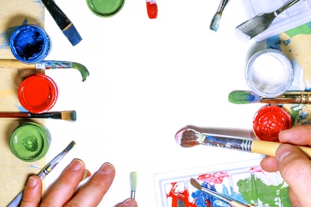 Color gouache jars on white background. Top view, copy space.の写真素材