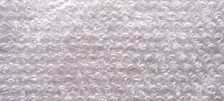 The texture of the packaging bubble film. Close-up. Selective focus.