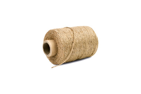 Skein of natural jute twine isolated on white background. Close up.
