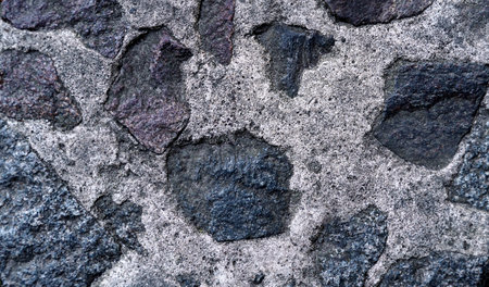 Wall made of natural granite stone. Close-up.