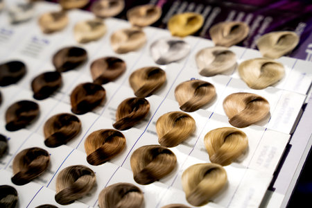 A palette of paint samples in a hair salon. Dyeing, changing hair color, safe haircare concept. Close-up. Selective focus.の写真素材